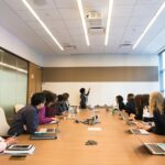 Business meeting with diverse team discussing projects in a modern conference room.